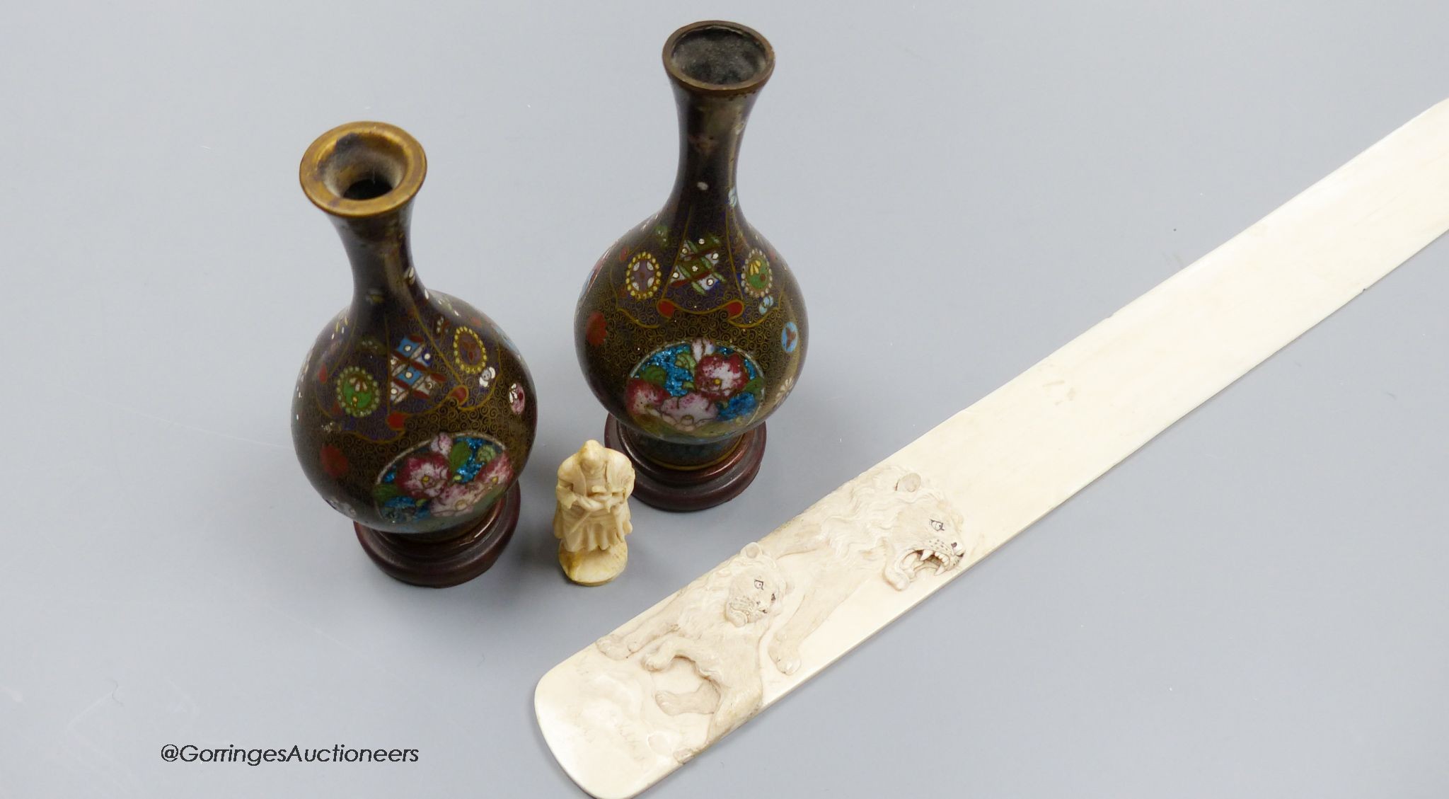 A pair of Japanese cloisonne miniature vases, a carved ivory paper knife, length 37cm, and a carved ivory figure